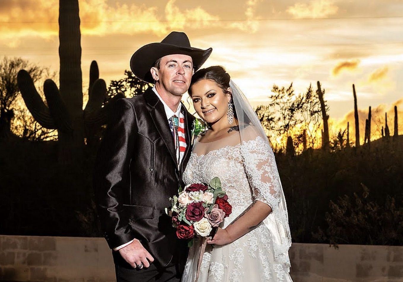 Couple with desert sunset landscape