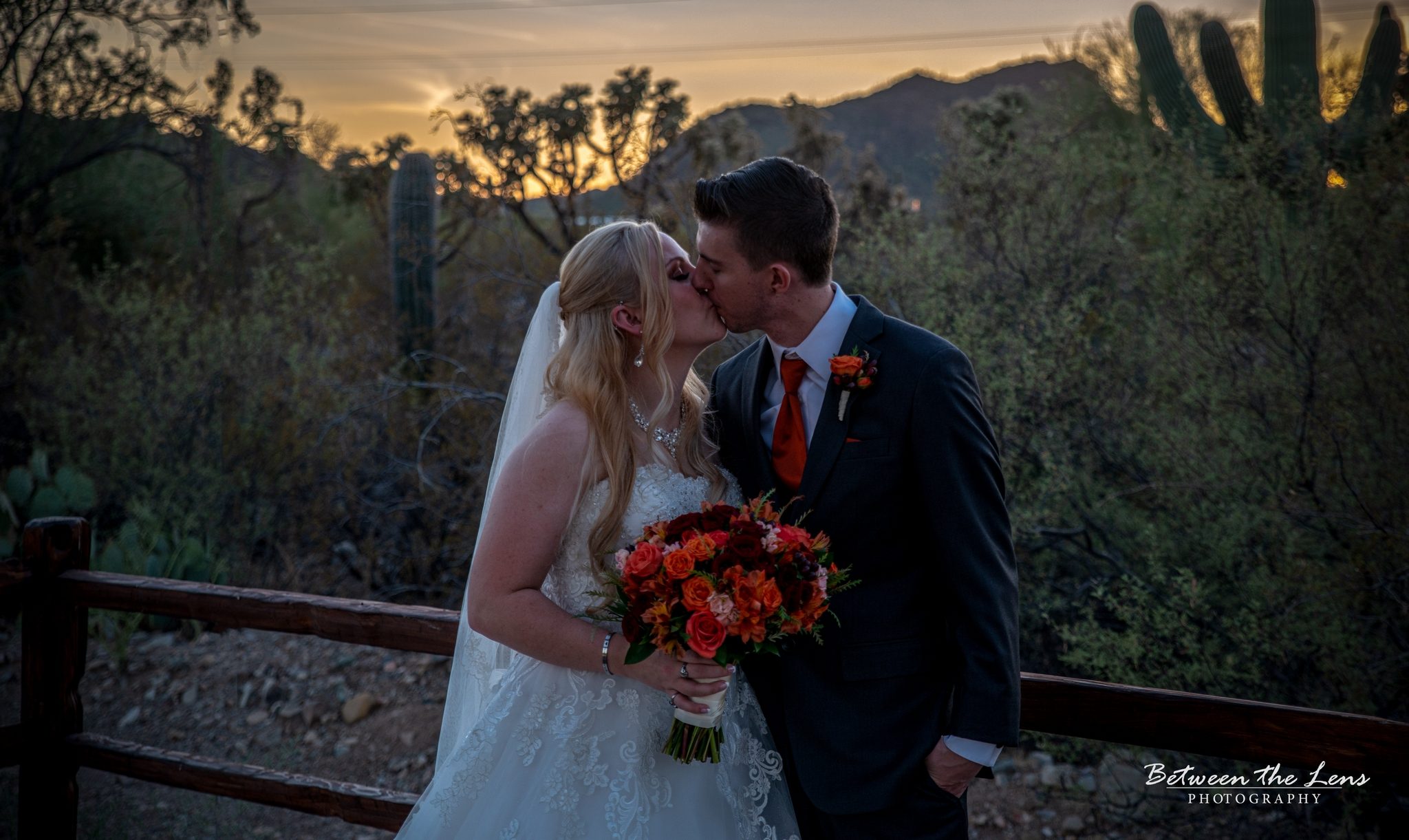 Couple kissing at sunset